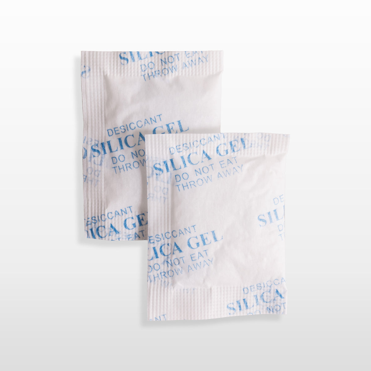 Dos sobres blancos de silica gel de 5 gramos.